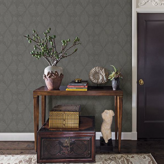 Rustic with a contemporary twist, this geometric wallpaper has the look of wood. Overlapping triangles dazzle with metallic highlights and raised inks.